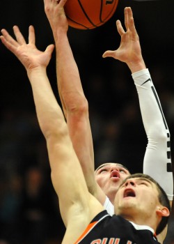 Triton's Joey Corder (back) grabs a rebound against Culver's Preston Hansel.