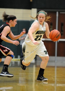 Wawasee's Hannah Haines works up court against NorthWood's Taitlyn Trenshaw.