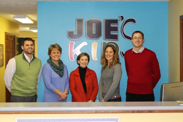 Joe’s Kids Board members Josh Wildman, David Bazzoni, and Winona Lake Limitless Park committee chair Erin Porter were on site to receive the grant along with Joe’s Kids Executive Director, Rebecca Bazzoni.  Check presented by Lynne Gilmore, AWS Foundation Executive Director (center). 