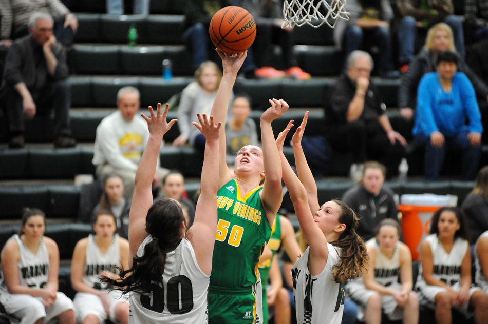 Tippecanoe Valley's Anne Secrest shoots over two Wawasee defenders for a bucket in Tuesday night's 45-25 Valley win in Syracuse. (Photos by Mike Deak)