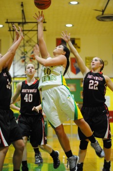 Tippecanoe Valley's Taylor Trippiedi drives through three NorthWood players to the basket.