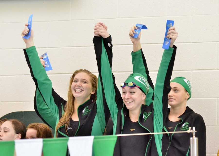 Concord's 200 free relay team celebrates its sectional title. (Photo by Nick Goralczyk)