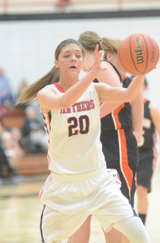 Jordyn Frantz goes for the basketball Saturday night. The NorthWood star scored 25 points as the Panthers beat Warsaw 40-32 for the program's first NLC title in 15 years.