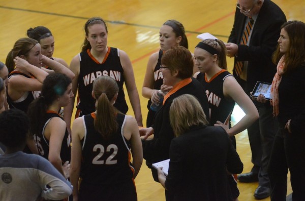 Coach Michelle Harter gives instructions to her Warsaw team during a timeout in the fourth quarter Saturday.