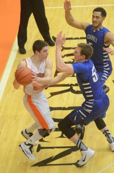 Nick Sands of Warsaw is trapped by a pair of Carroll defenders (Photo by Scott Davidson)