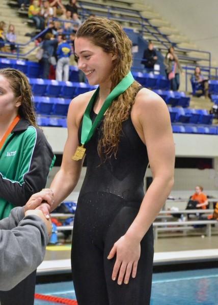 Wawasee's Bre Robinson accepts her medal after finishing fifth in the 100 fly Saturday afternoon. (Photos by Nick Goralczyk) 