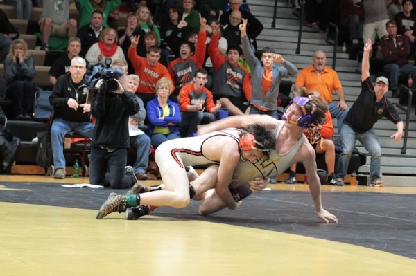 Warsaw's Kyle Hatch takes down Jake Hartman of South Bend Clay to win the 120-pound division title at the Rochester Regional on Saturday (Photos provided by Scott Gareiss)