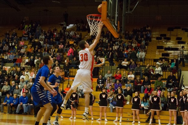 Jake Mangas was the hero for Warsaw Friday night. The senior hit a layup at the final horn in overtime to give the Tigers a 48-47 win over Carroll (Photo by Ansel Hygema)