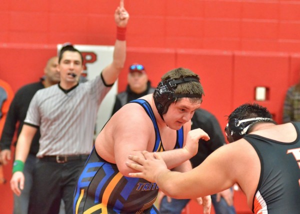 Triton's Justin Hefner escapes from Warsaw's Anthony Penn to clinch a victory in the fifth overtime of a sectional semi-final last Saturday.