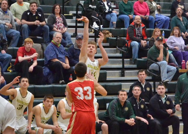 Gage Reinhard, and everyone behind him, look on as he sinks his second three-point shot of OT. (Photos by Nick Goralczyk)