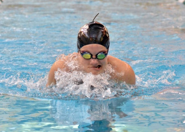 Shelby Adams on the home stretch of her 100 breast.