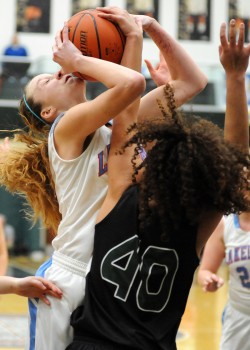 Wawasee's Seaquinn Bright (40) swats the shot attempt of Lakeland's Taylor Yerington.