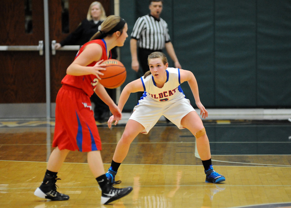 Whitko defender Brianna Cumberland zeroes in on West Noble guard Shawna Young.