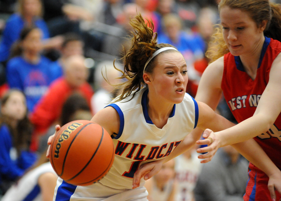 Whitko's Emily Day blows past West Noble defender Kaylie Warble during Whitko's 56-39 win at the Wawasee Girls Basketball Sectional. (Photos by Mike Deak)