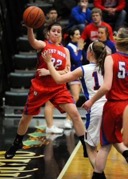 West Noble's Kenzie Cox tries to save a loose ball.