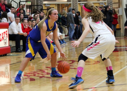 Triton's Kylie Mason looks for room to move against South Central.