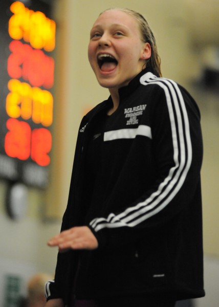  Warsaw's Brenna Morgan showed some rare emotion on the podium after setting the sectional record, and tying her school record at 24.07, in the 50-yard freestyle at the Warsaw Girls Swimming Sectional. (Photo by Mike Deak)