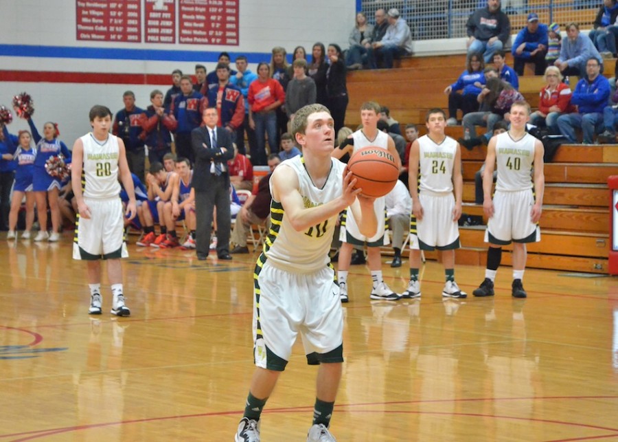 Wawasee seniors watchon as fellow senior Aaron Voirol takes two free throws following a technical on Whitko during Tuesday's sectional opener. Voirol led Wawasee with 23 points. (Photos by Nick Goralczyk)