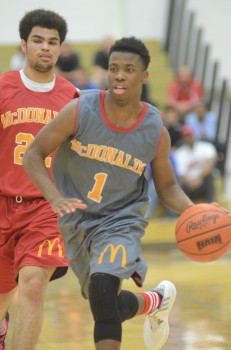 Reontre Lwarence of South Bend Riley heads up the court.