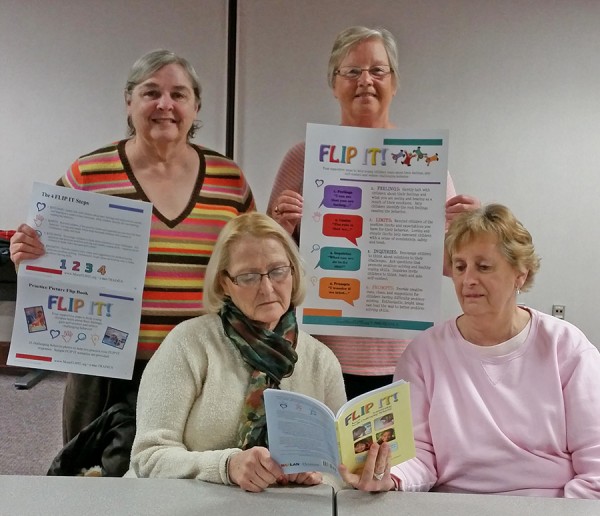 Altrusans review materials for Beaman Home’s new Children’s Program beginning once Beaman Home staff moves into their new campus on North Parker Street this spring. (Front L to R:  Martie Lennane and Jeanine Knowles; Back L to R:  Susan Woodward & Jan Sloan) 