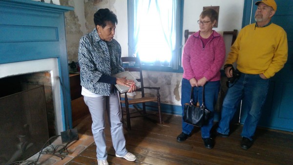 Docent Eileen Baker-Wall, great-great granddaughter of an escaped slave who made his home in Wayne County, leads visitors on a tour of the Coffin historic site.