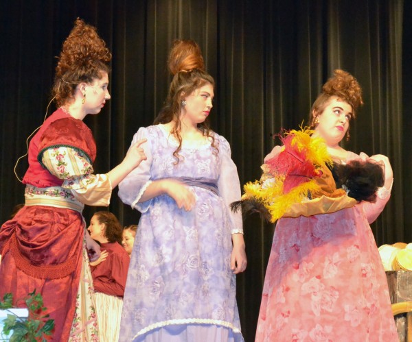 From left, Carly Erst (the stepmother), plus Kara Schrock and Laura Stump, as the stepsisters, provide comedic banter throughout the musical, including over their hat find.