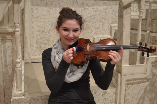 Carly Erst holds the gold medal she won Saturday in Indianapolis at the Indiana State School Music Association state contest and she is also holding the violin she used to earn the medal.