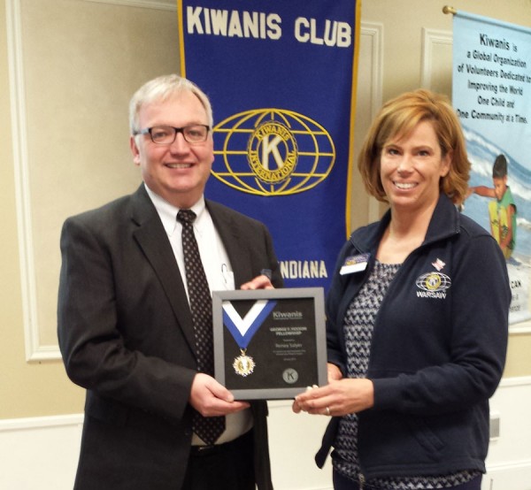Kiwanis Club of Warsaw President Renea Salyer, Kosciusko Chamber of Commerce, received her Hixson award from Club Eliminate Chairman Michael Bergen, Alderfer & Bergen.