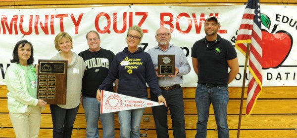 (from left) Barb Smolen, Warsaw Education Foundation Executive Director, presenting the Quiz Bowl traveling trophy and first place winner's plaque to Melanie Kleinhans, Dr. Tim Cook, Amy Waggoner, Dr. Thomas Howard, Perry Waggoner.  (Photo provided)