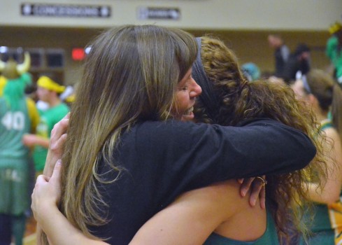 Lorene Teel hugs her daughter Caylie after her team be Rochester to win semi-state.