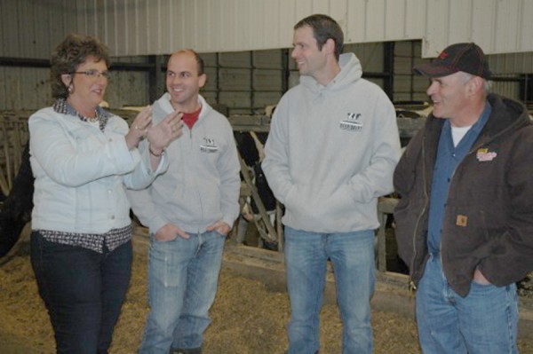 Rep. Jackie Walorski talks with Beer Dairy Inc. owners Regg Beer,left, Jeff Beer and Fred Beer, Milford, Wednesday during her two-day agricultural tour of the district. (Photo by Ray Balogh)