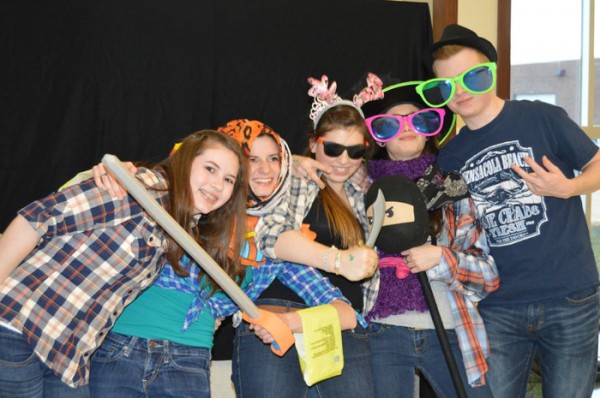 Wawasee High School students (from left) Emma Alfano, Sophia Nyce, Kara Schrock, Jade Davidson and Riley Thomas have some "dress up" fun at the photo booth during the third annual PowWow held at WHS. (Photos by Keith Knepp) 