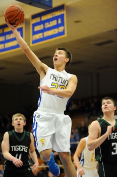 Triton's Austin Sellers flies in for a layup against LaCrosse.