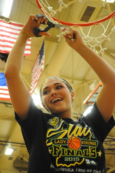 Valley senior cuts down the nets after her team's semi-state win. (Photos by Mike Deak)