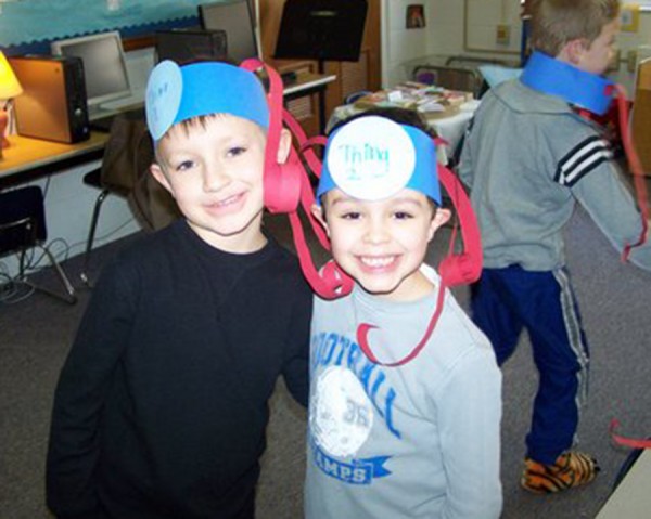 Pierce Miller (left) and Noah Leasure (right) are pictured with Thing 1 and Thing 2 crazy headbands they made for silly photos.