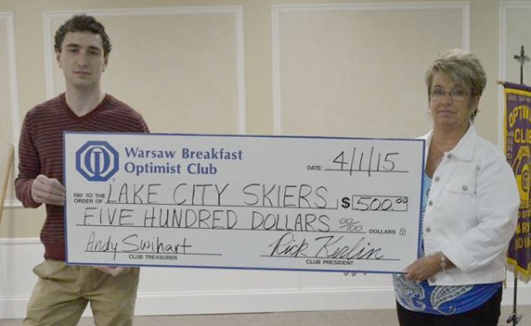 Matt Voss, representing Lake City Skiers accepts a check from Michelle Bickel, representing the Warsaw Breakfast Optimist Club.