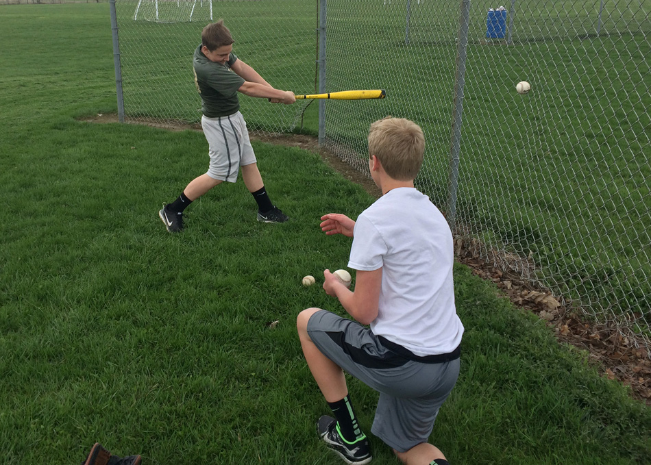 Brandon Baker takes a cut from the toss of Jacob Carson during a hitting training session through the Wawasee baseball camp. (Photo provided)