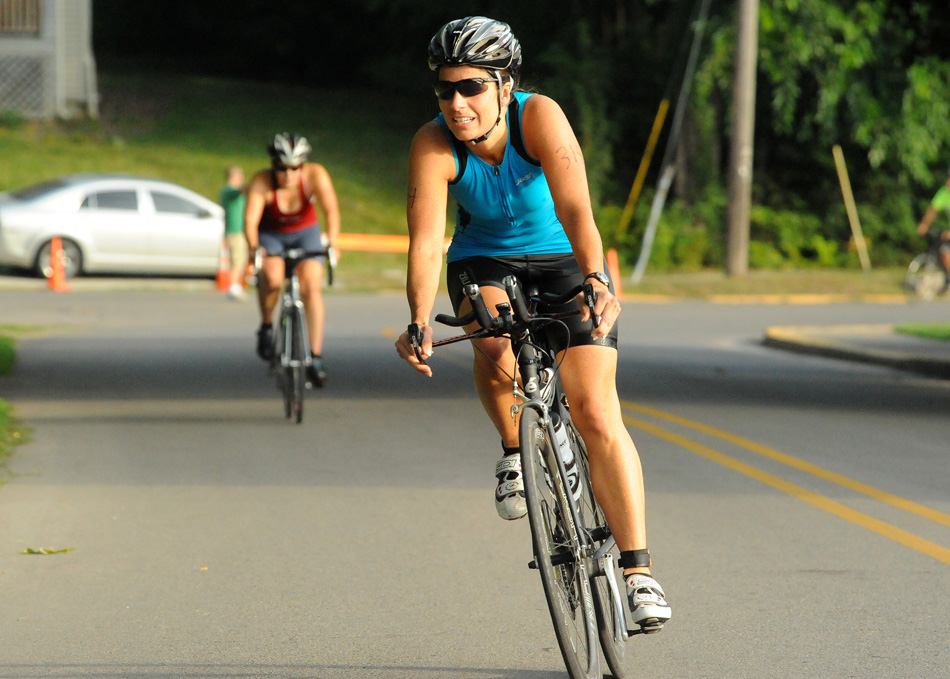 Stephanie Wilson hits the road on the bike portion of the 2014 Wawasee Triathlon. (File photo by Mike Deak)