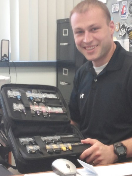 Jordan Foreman shows some of the tools of the trade, which include various cables and connectors.