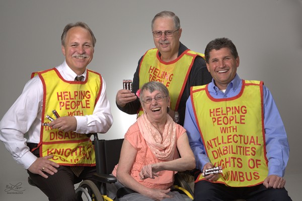 Knights of Columbus Dan Hampton, Chuck Whitcraft and Dave Smolen surround Nona Bliton, one of 72 people benefitting from Cardinal Services’ community living program.