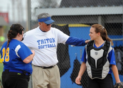Triton head coach Steve McBride works out some kinks with pitcher Brycelyn Garbison (left) and catcher Zoee Stephen.