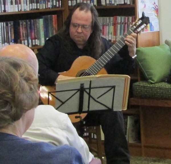 Scott Workman played his classical guitar to a crowd of 14 people on Thursday, April 23.
