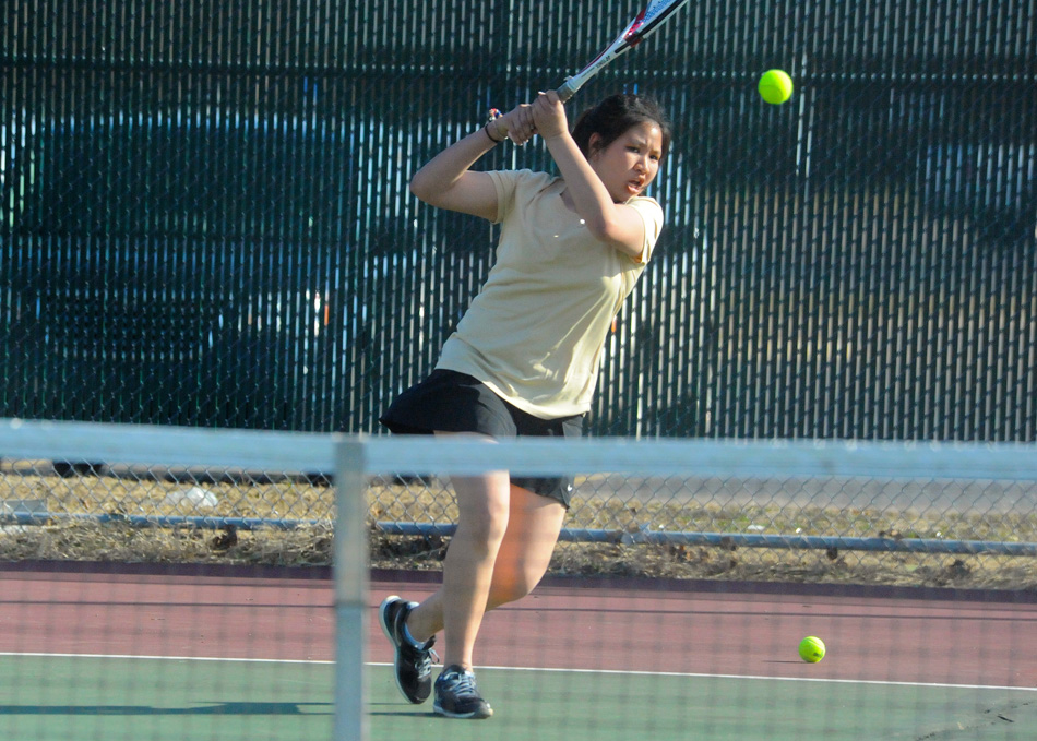 Wawasee's Than "Nealy" Thinisdgsdg fires a return volley to WHO from Central Noble Wednesday in the No. 2 singles duel. (Photos by Mike Deak)