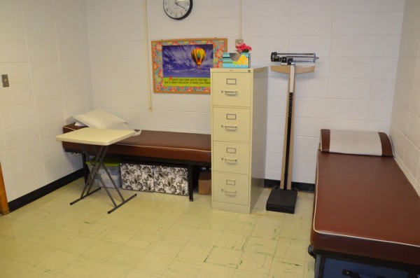 This tiny nurses's office at Lincoln Elementary can see up to 45 students in a day. Students often share a cot to be treated with overflow students sitting in the main office. 