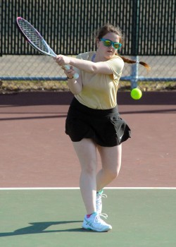 Charity Parker of Wawasee's No. 1 doubles team rallies with Central Noble.