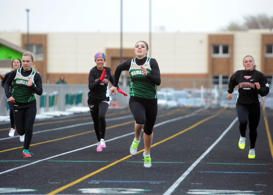 Wawasee's Leigh-Ann Shrack (center) leads the pack of 200-meter dash runners to the line Tuesday night. From left to right are Catherine Yankosky, Kenzie Moren, Shrack and Taitlyn Trenshaw. (Photos by Mike Deak)