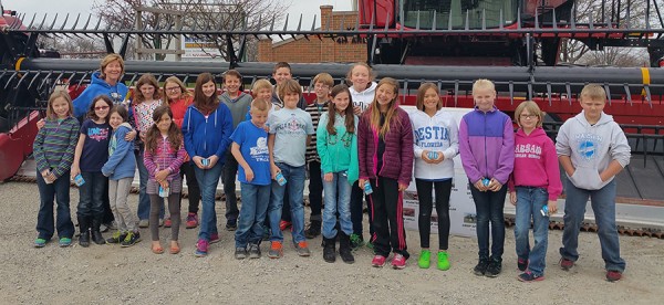 Pictured is Mrs. Dingeldein's class in front of a 35 foot combine attachment.