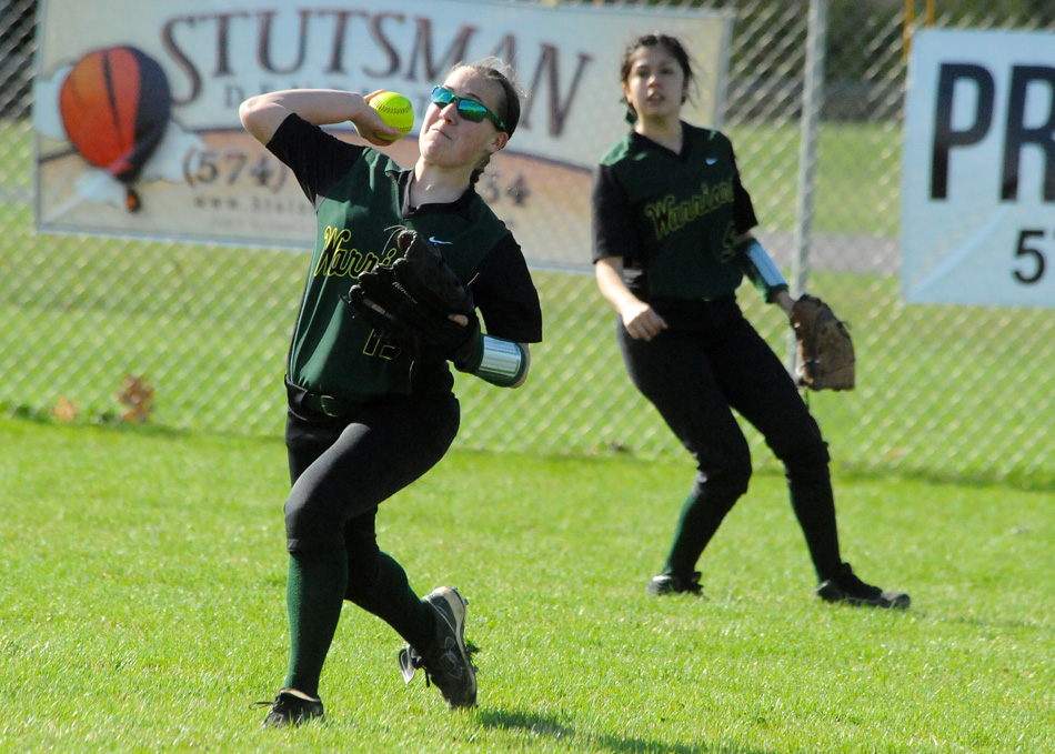Wawasee right fielder Kayla White rockets a throw back to first base to double off a runner in the second inning.
