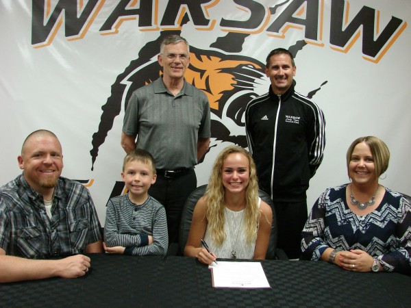 WCHS senior Mariah Harter will run track at Huntington University. Harter is shown above with (from left) Matt Burnworth, Jamison Burnworth and Janel Bournworth. In back are WCHS girls track coach Scott Erba and Huntington track coach Tom King (Photo provided)