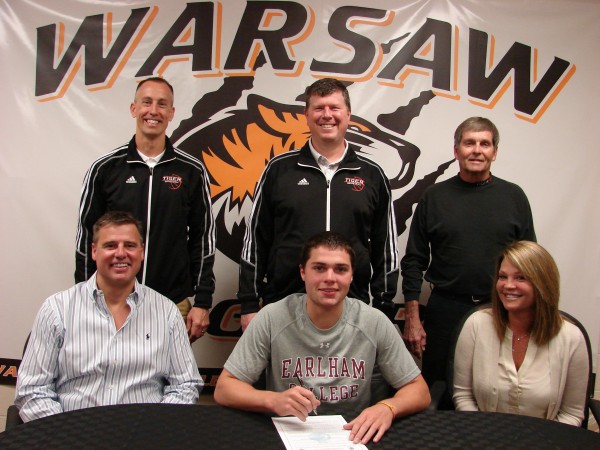 WCHS senior Nick Sands will continue his basketball career at Earlham College. Sands is shown above with his parents Dan and Lisa. In back are WCHS head coach Doug Ogle (center), flanked by assistant coaches David Wayne (left) and Hal Gunter (right). (Photo provided)